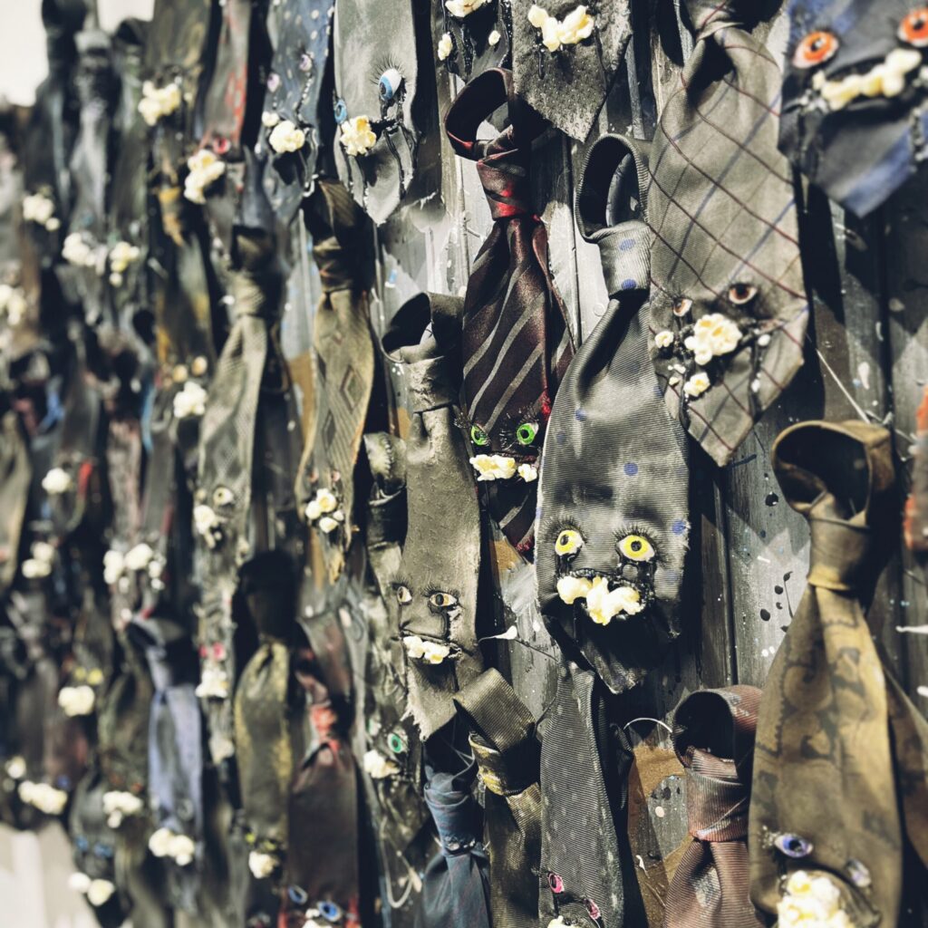 【The Weeping Ties】 2023 Vintage necktie, popcorn, resin, stone clay, acrylic paint, false eyelashes, wire, wooden board, spray, paint Detail Rin Northwind リン ノースウィンド